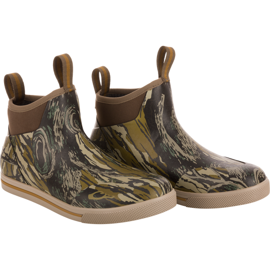 A pair of camouflage patterned waterproof boots designed for outdoor use, featuring a non-marking rubber outsole.