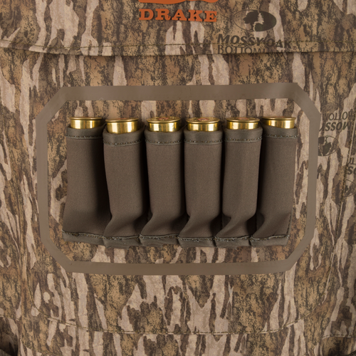 Hardline Insulated Breathable Wader with elastic shell holder, six shotgun shells, Mossy Oak camo pattern, and “DRAKE” logo, showcasing durable, insulated hunting gear.