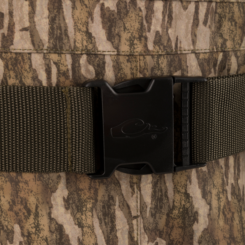Close-up of a quick-release buckle on the Hardline Insulated Breathable Wader, showcasing durable, camouflaged fabric, part of Purewhitelaneshop's high-quality hunting gear.