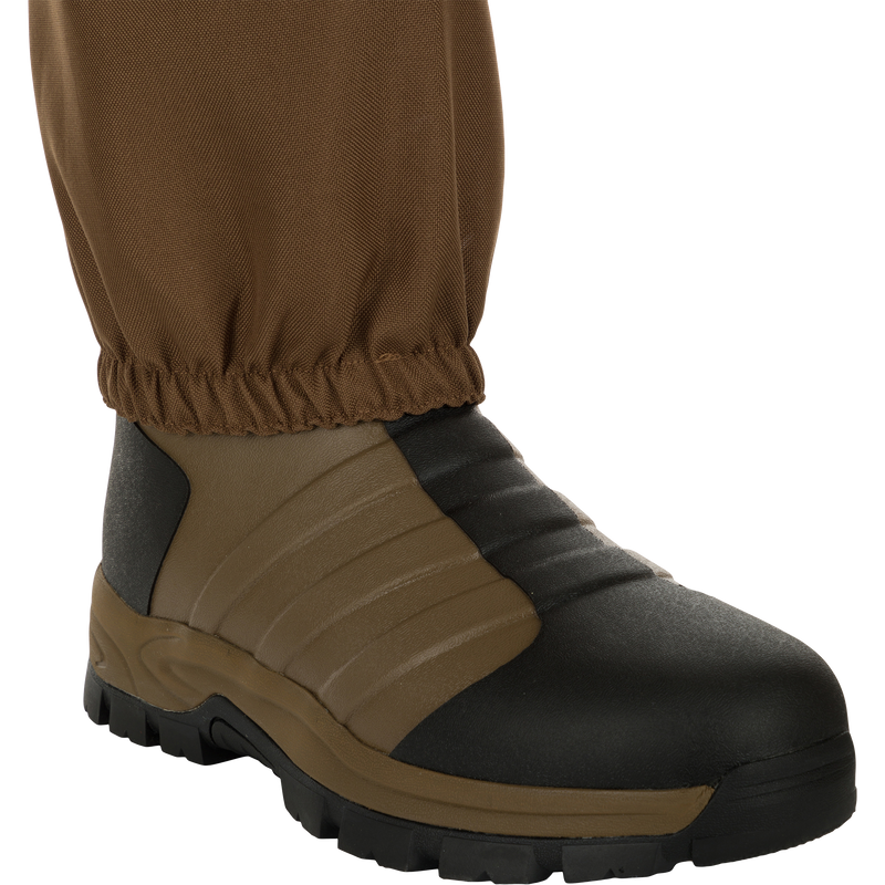 EST Waterfowler's Hip Boot, designed for marsh navigation, features breathable GE3 fabric, athletic lug outsole for traction, and adjustable hip strap for comfort and mobility.