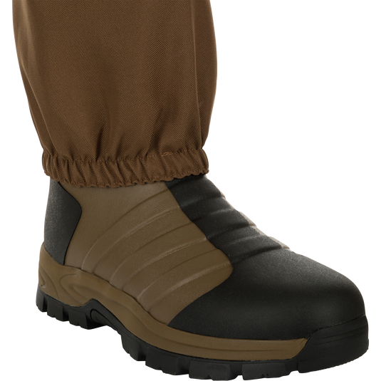 EST Waterfowler's Hip Boot, designed for marsh navigation, features breathable GE3 fabric, athletic lug outsole for traction, and adjustable hip strap for comfort and mobility.