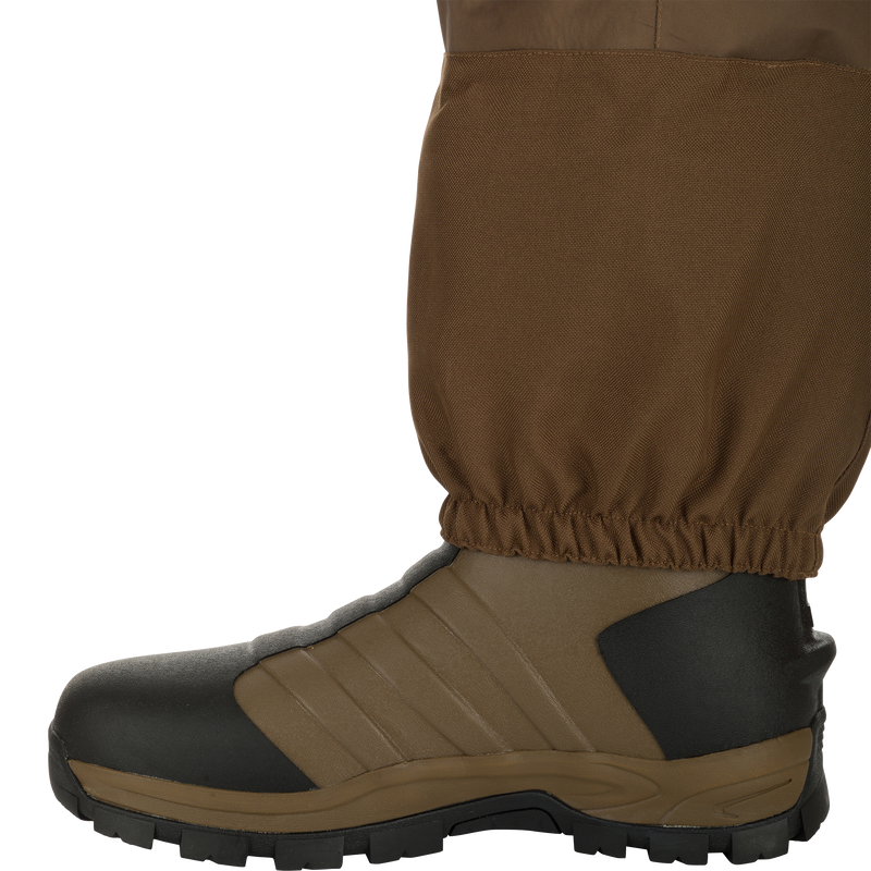 EST Waterfowler’s Hip Boot designed for marsh navigation, featuring GE3 Wader Material, athletic lug outsole, EVA midsole, and adjustable hip strap for comfort and traction.