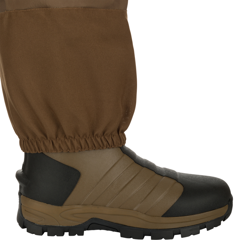 EST Waterfowler’s Hip Boot designed for marsh navigation, featuring athletic lug outsole, breathable GE3 fabric, and adjustable strap for comfort and mobility.