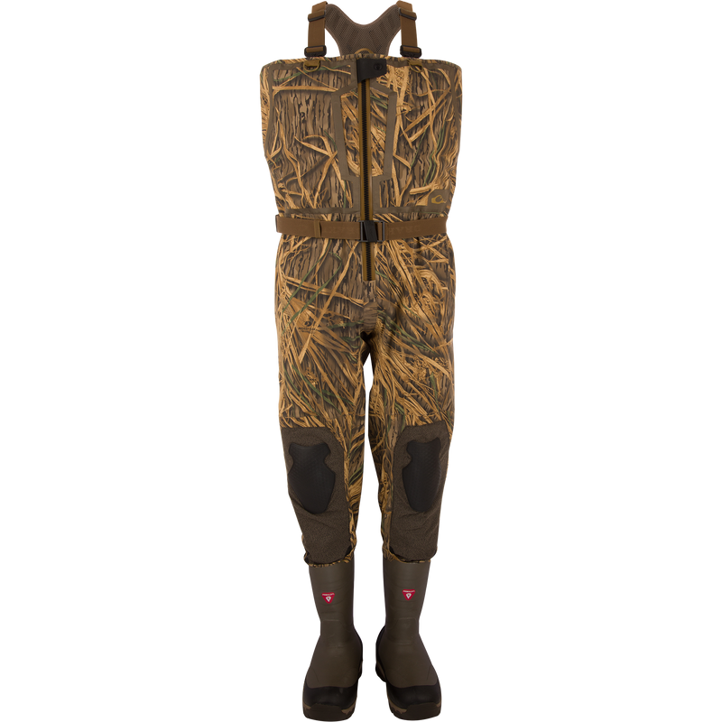 BMF1600 Kevlar Wader with Primaloft, featuring camouflage pattern, built-in rubber boots, adjustable harness, reinforced knees, and front-zip entry for waterfowl hunting.