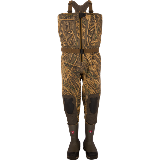 BMF1600 Kevlar Wader with Primaloft, featuring camouflage pattern, built-in rubber boots, adjustable harness, reinforced knees, and front-zip entry for waterfowl hunting.