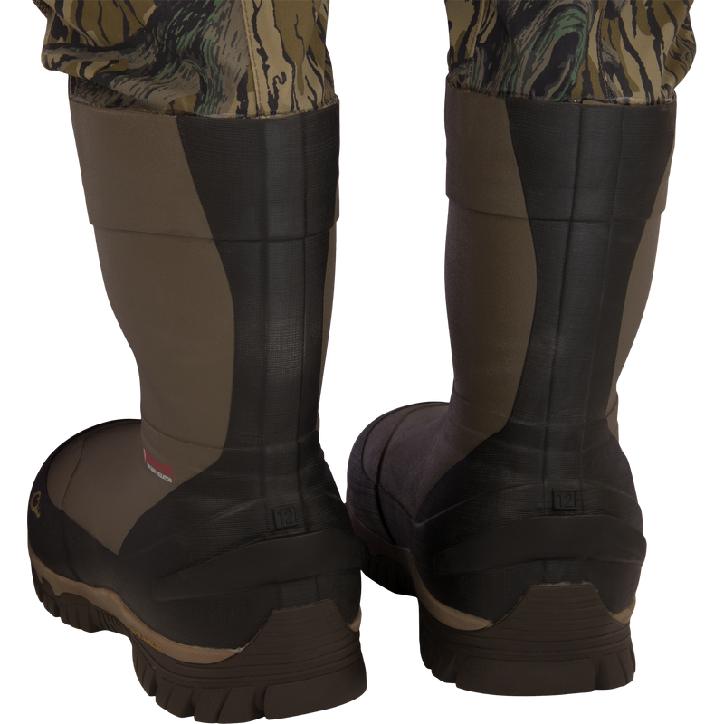 Back view of BMF1600 Kevlar Wader with Primaloft, featuring camo-patterned legs tucked into insulated rubber boots, highlighting durability and advanced construction.