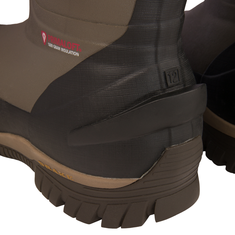 Close-up of BMF1600 Kevlar Wader with Primaloft's heel and lugged outsole, showcasing the 1600g insulation label and molded size-12 tag for superior traction and warmth.