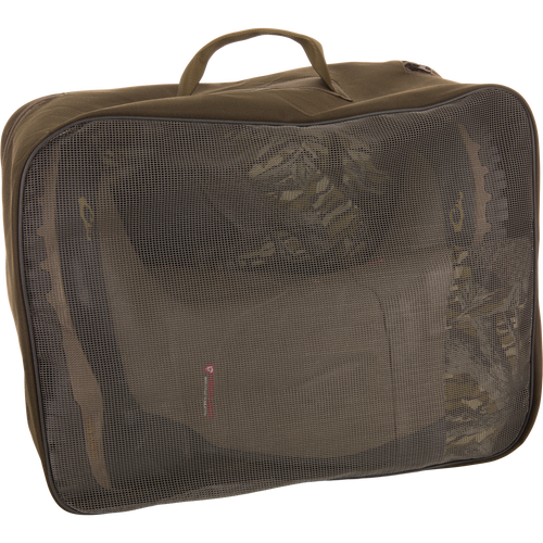 BMF1600 Kevlar Wader with Primaloft inside an olive-green travel packing cube, visible through mesh panel, showcasing its compact storage for hunting gear.