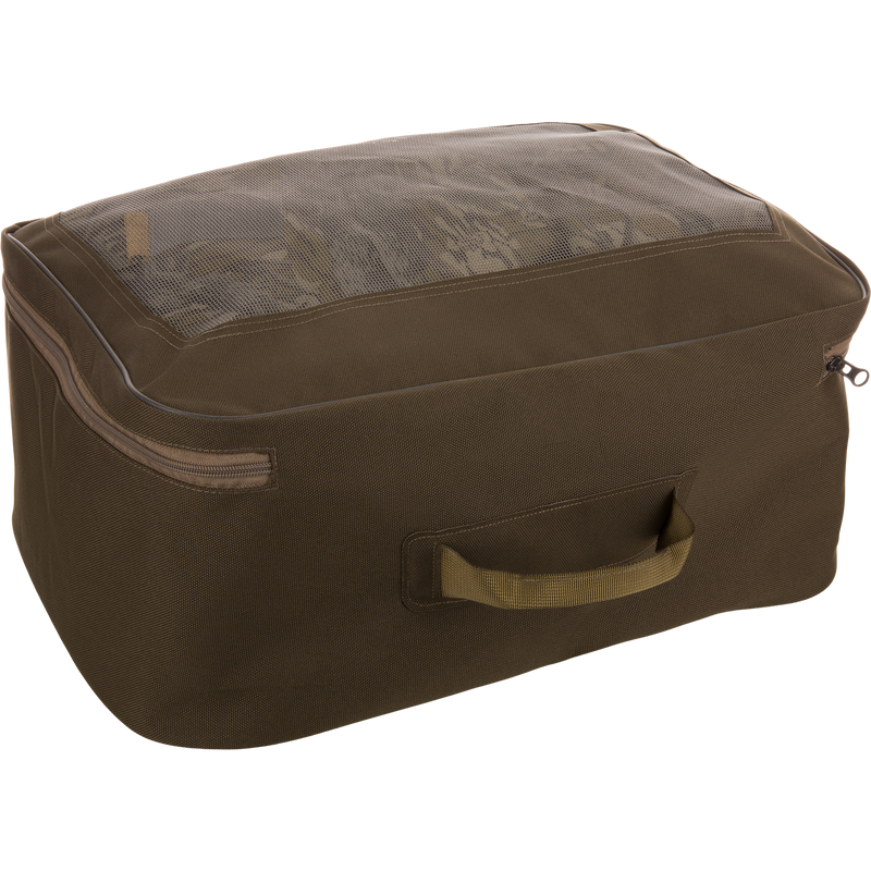 Olive-green storage cube with mesh top displaying folded garments, representing the BMF1600 Kevlar Wader's mesh carry bag inclusion for organized travel.