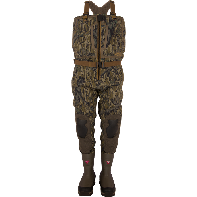 BMF1600 Kevlar Wader with Primaloft, featuring woodland camouflage, adjustable suspenders, front zipper, reinforced knees, and built-in boots for advanced waterfowl hunting protection.