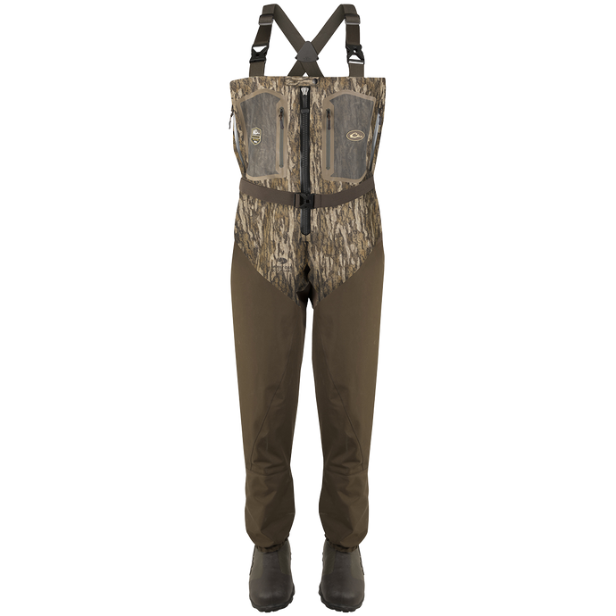 Guardian Elite Front Zip Insulated Wader with sewn-in liner, featuring a camouflage pattern, adjustable straps, front zipper, chest pockets, and built-in boot feet for fly-fishing or hunting.