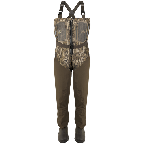 Guardian Elite Front Zip Insulated Wader with sewn-in liner, featuring a camouflage pattern, adjustable straps, front zipper, chest pockets, and built-in boot feet for fly-fishing or hunting.