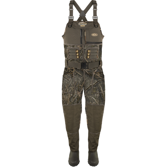 Buckshot Eqwader 1600 Neoprene Wader 3.0 displayed with camouflage overalls, emphasizing its durable construction and comprehensive seam protection for waterfowl hunting.