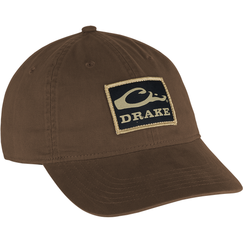 Cotton Twill Patch Cap with a low profile, contoured bill, and brass buckle back strap, embodying casual style suitable for outdoor and hunting enthusiasts.