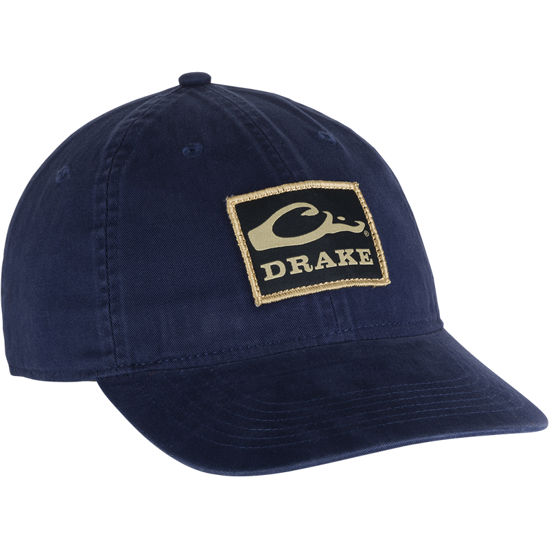 Cotton Twill Patch Cap with low profile, contoured bill, and adjustable brass buckle back strap, crafted from 100% cotton twill for a stylish look.