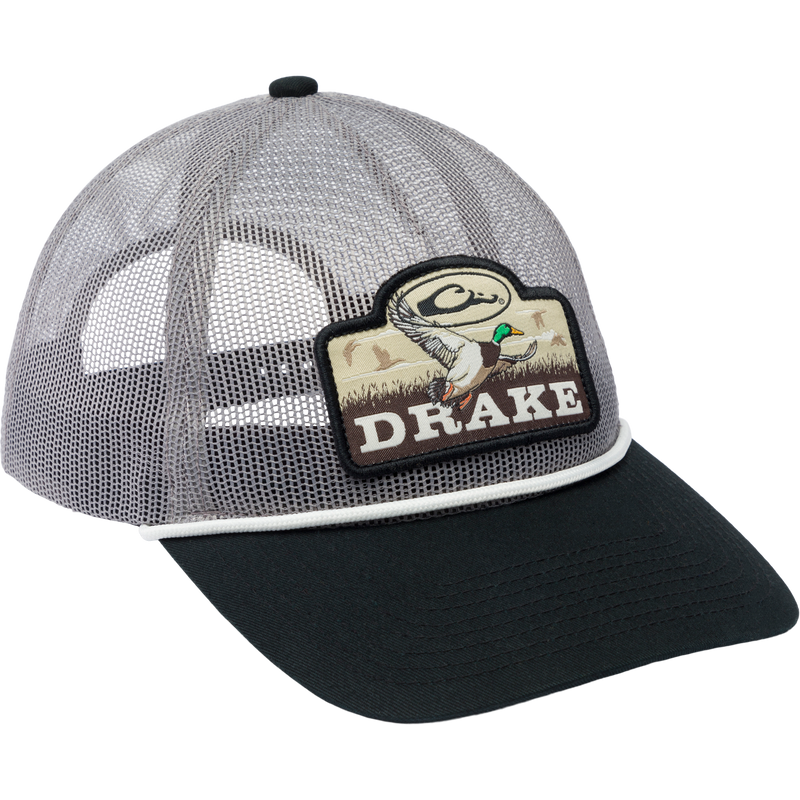 Drake Mallard All Mesh Cap features a woven duck patch on a polyester mesh, with an enzyme-washed finish and adjustable snap back closure.