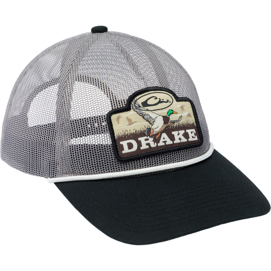 Drake Mallard All Mesh Cap features a woven duck patch on a polyester mesh, with an enzyme-washed finish and adjustable snap back closure.