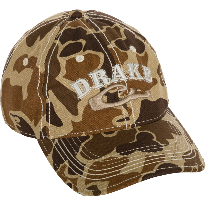 Distressed 6-Panel Ball Cap with raised Drake Logo embroidery, frayed visor, and contrast stitching. Cotton twill panels and adjustable closure.