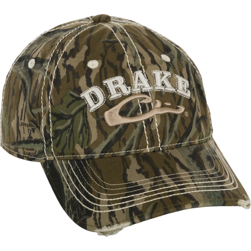 Distressed 6-Panel Ball Cap with raised Drake Logo embroidery, frayed visor, and contrast stitching. Non-structured, cotton twill panels and adjustable closure.