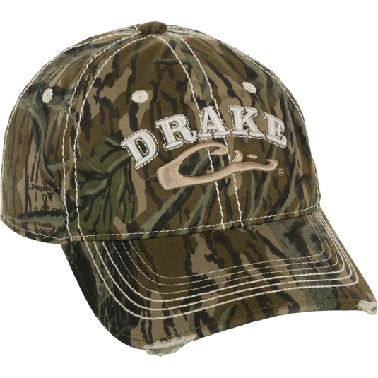Distressed 6-Panel Ball Cap with raised Drake Logo embroidery, frayed visor, and contrast stitching. Non-structured, cotton twill panels and adjustable closure.