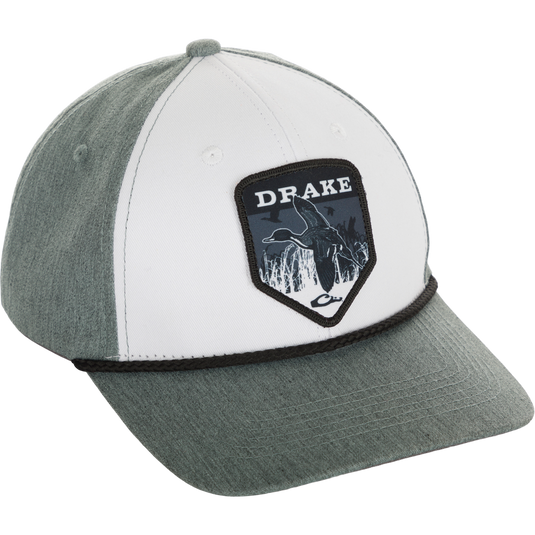 Drake In-Flight Badge Cap with adjustable snapback, structured 6-panel design, slight pre-curved visor, and Drake logo on the back center.