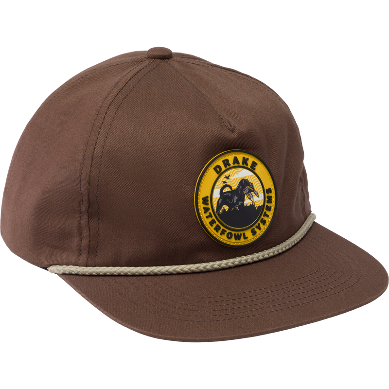 Drake Lab Patch Rope Cap with a flat visor and silicone patch, featuring a breathable cotton twill construction and adjustable snap-back closure for a customized fit.
