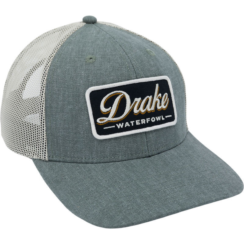 Herringbone Patch Mesh Back Cap with structured pro round crown, chino twill front, breathable mesh back, woven loop label, and plastic snap closure.