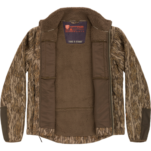 Camouflage-patterned Midweight Nova Silencer Jacket with Agion Active X2, unzipped to show fleece lining, brand label, and reinforced elbow panels, emphasizing functionality and hunting practicality.