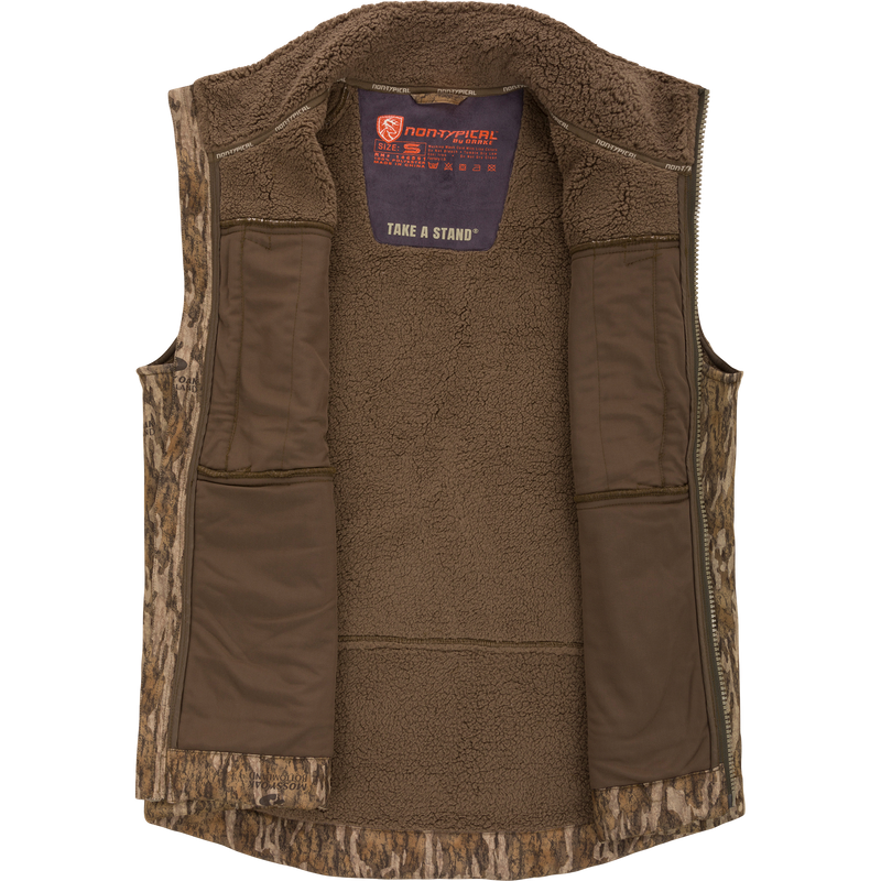 Midweight Nova Silencer Vest with Agion Active X2, featuring a camouflage shell, brown fleece lining, zip-front, interior pockets, and safety harness pass-through, ideal for hunting enthusiasts.