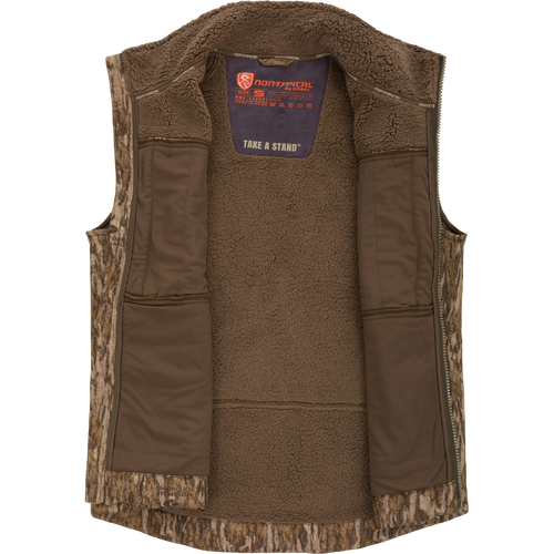 Midweight Nova Silencer Vest with Agion Active X2, featuring a camouflage shell, brown fleece lining, zip-front, interior pockets, and safety harness pass-through, ideal for hunting enthusiasts.