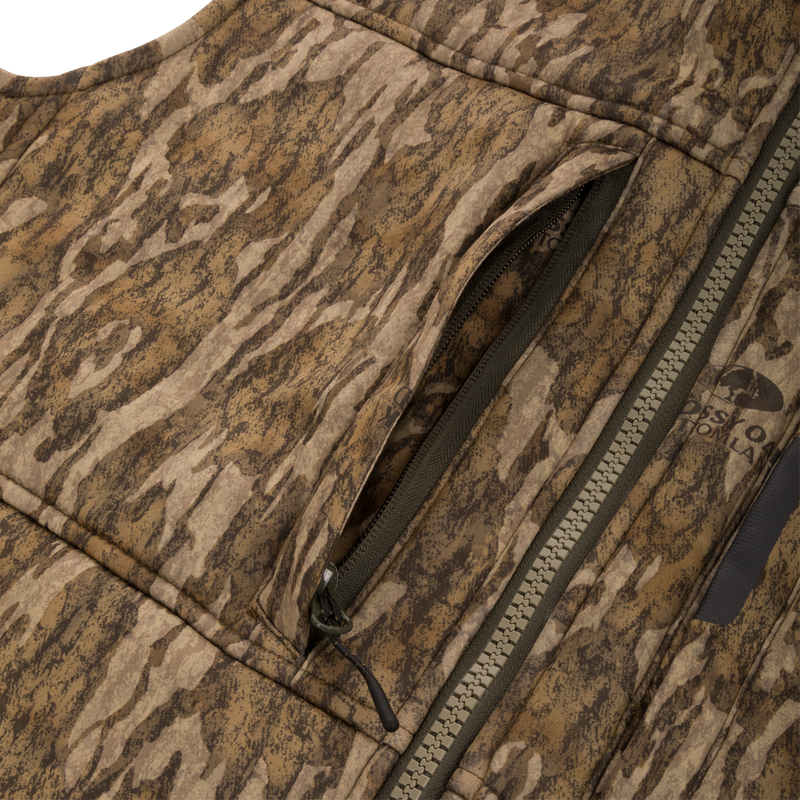 Midweight Nova Silencer Vest with Agion Active X2 featuring Bottomland camo print, zippered chest pocket, and Mossy Oak logo, ideal for hunting with advanced odor protection.