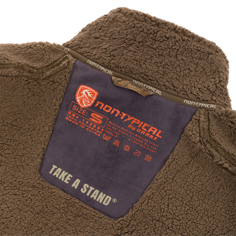 Inside collar label of the Midweight Nova Silencer Vest with Agion Active X2, showing brand, size, care instructions, and functional features for outdoor enthusiasts.