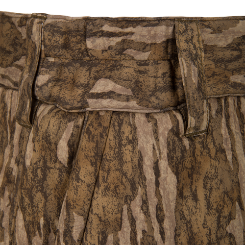 Midweight Nova Silencer Pant with Scent Control featuring camo fabric, pleated design, and a stretch waistband for enhanced mobility, ideal for hunting with anti-odor and water-resistant technologies.