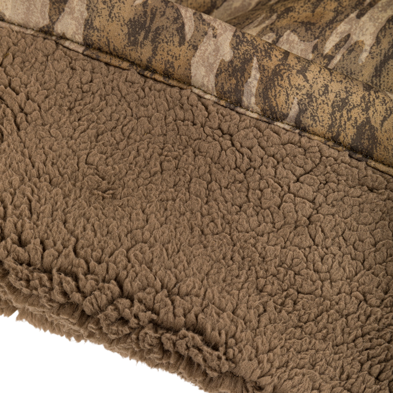 Midweight Nova Silencer Pant with Scent Control featuring brown sherpa fleece lining and camo-patterned shell, showcasing durable, warm, and quiet materials with advanced scent control technology.