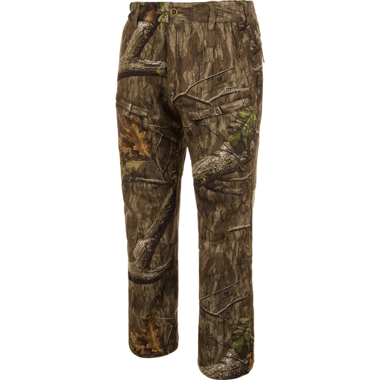 Midweight Nova Silencer Pant with Scent Control in woodland camouflage, featuring durable, water-resistant fabric with anti-odor technology, stretch waistband, and multiple zippered pockets for enhanced hunting mobility.