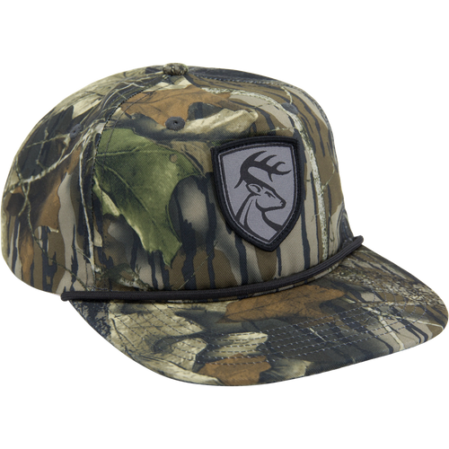 Non-Typical X Lost Hat Goat Rope Hat, a 5-panel camo trucker cap with deer logo patch, adjustable snap back, and rope detail above the brim.