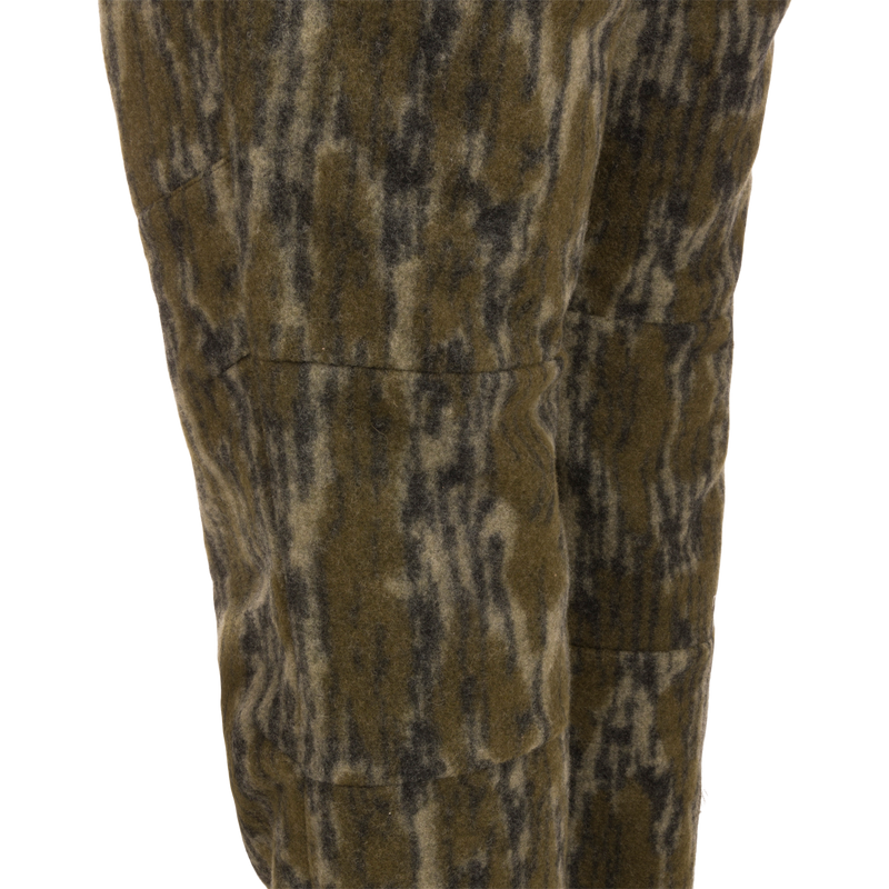 Midweight Hydrowool Softshell Pant with Scent Control featuring olive-green camo-patterned fleece, showcasing durable and waterproof fabric ideal for outdoor and hunting activities.