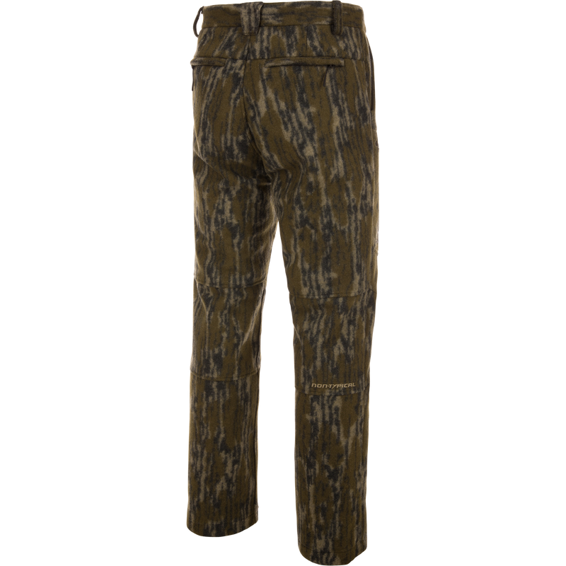 Midweight Hydrowool Softshell Pant with Scent Control features a camouflage design, rear welt pockets, articulated knee seams, and a Non-Typical logo, ideal for outdoor adventures.