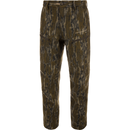 Midweight Hydrowool Softshell Pant with Scent Control, featuring camouflage pattern, zippered pockets, and buttoned waistband, ideal for hunting with windproof, waterproof, and anti-odor properties.