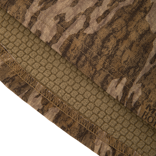 Non-Typical SWT Hybrid Half Zip with Scent Control, featuring camo pattern, overlocked hem, and soft fleece lining, ideal for hunting with moisture-wicking and anti-odor technology.