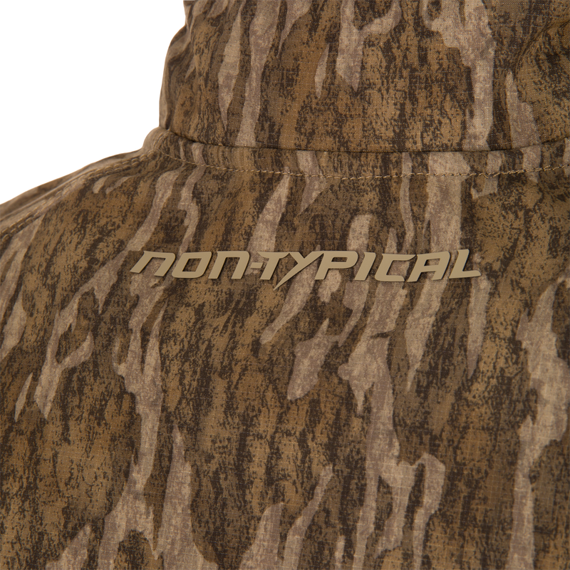 Close-up of the collar area on the Non-Typical SWT Hybrid Half Zip, showcasing its camouflage pattern and NON-TYPICAL text, ideal for hunting apparel.