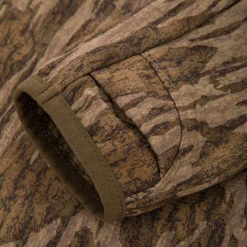 Non-Typical SWT Hybrid Half Zip's ergonomic thumbhole cuff, showcasing precise stitching and innovative SWT stretch material, designed for breathability and moisture-wicking in hunting apparel.