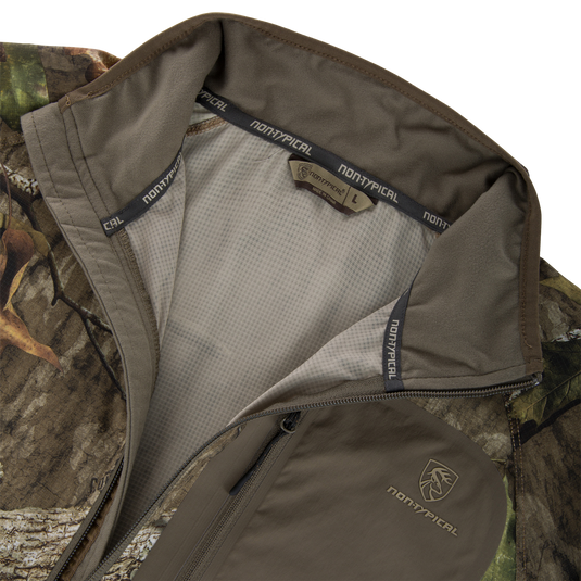 Non-Typical Lightweight SWT Half Zip Pullover with Scent Control, featuring camo-pattern, mesh lining, ergonomic thumbholes, and chest branding, designed for hunting and outdoor activities.