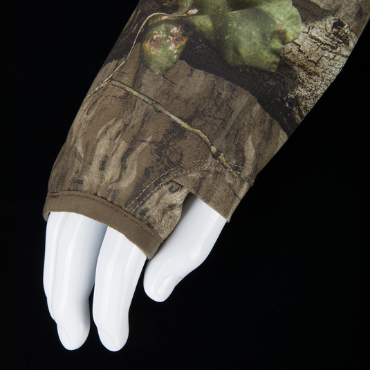 Non-Typical Lightweight SWT Half Zip Pullover with Scent Control on mannequin hand, showcasing camo pattern, thumb hole, and hemmed cuff for hunting and outdoor use.