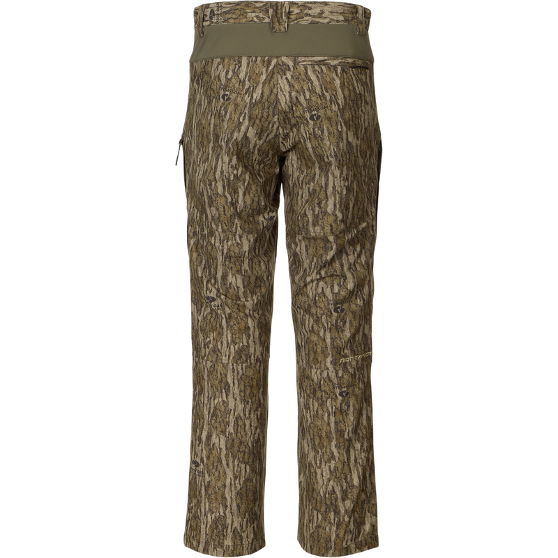 Back view of the Non-Typical Pant with Spider Web Technology in a tree-bark camouflage print, featuring a stretch waistband and knee pad compatibility for hunting comfort.