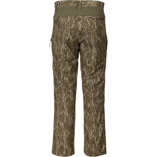 Back view of the Non-Typical Pant with Spider Web Technology in a tree-bark camouflage print, featuring a stretch waistband and knee pad compatibility for hunting comfort.