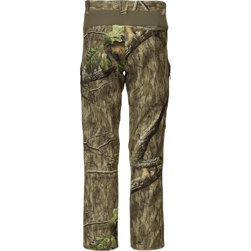 Rear view of Non-Typical Pant with Spider Web Technology, showcasing camouflage pattern and stretch waistband, designed for durability and comfort in hunting environments.