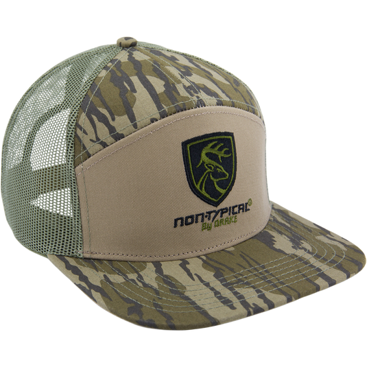 Camouflage-patterned trucker hat with green mesh back, tan front, camo brim, featuring a deer-head shield logo and non-typical® by ORYX, ideal for hunting enthusiasts.
