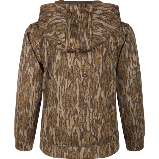 Back view of the Youth Non-Typical Performance Hoodie with Agion Active, featuring a camo pattern and Mossy Oak Bottomland logo, displayed on a mannequin.