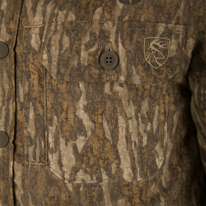 Close-up of the Non-Typical Campfire Hoodie's pocket, featuring a deer-head emblem and buttoned flap, reflecting its functionality and outdoor hunting apparel style.